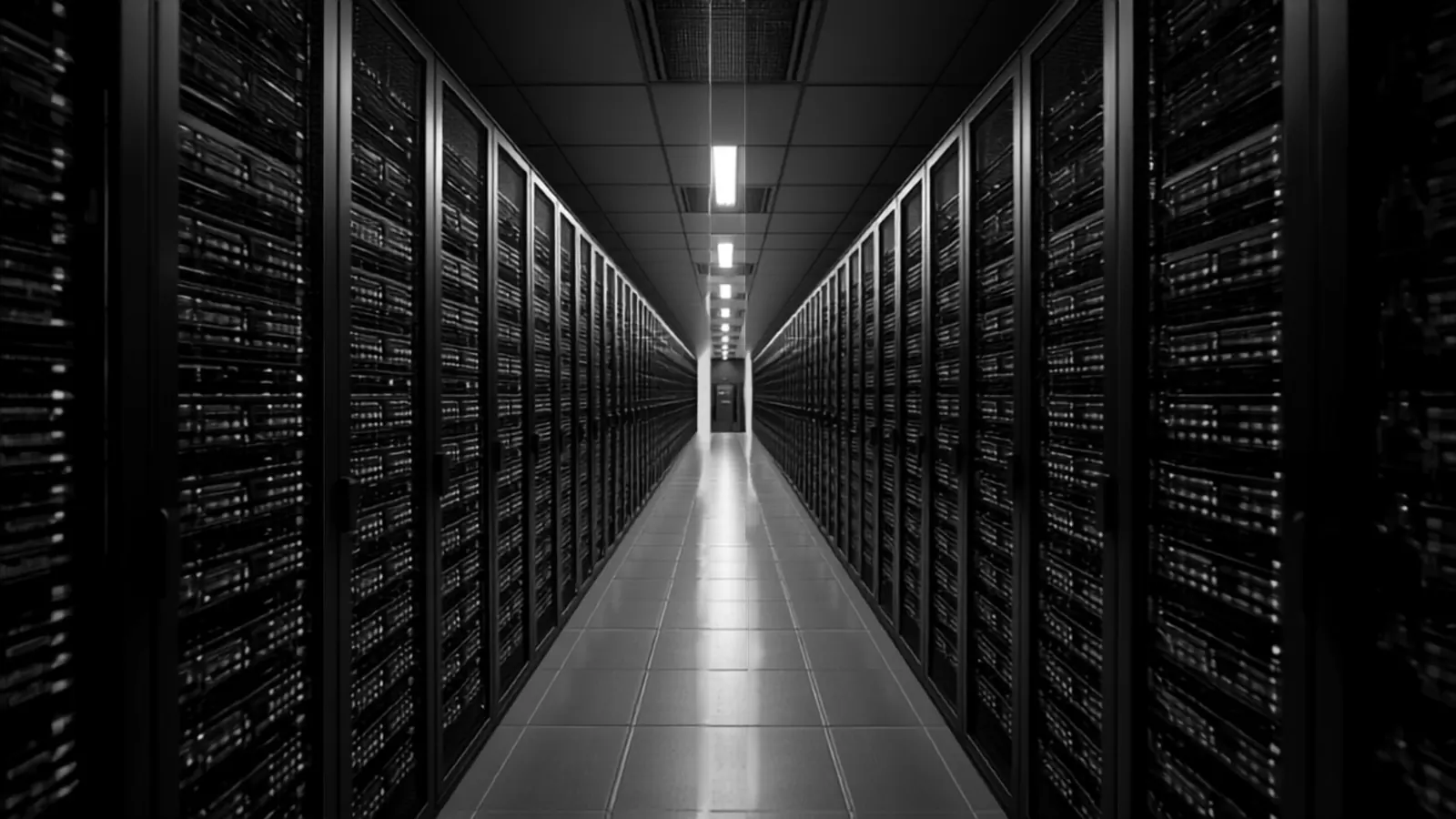 A long corridor of server racks in a data centre